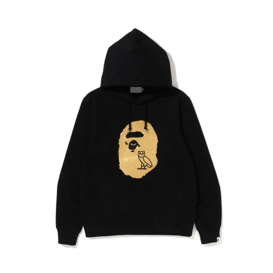 Black hoodie with a gold graphic on a white background