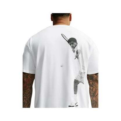 A man viewed from the back wearing a white t-shirt with a large black-and-white graphic print of a tennis player on the back.